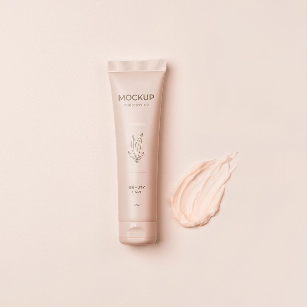 A white tube of cream next to some lotion.