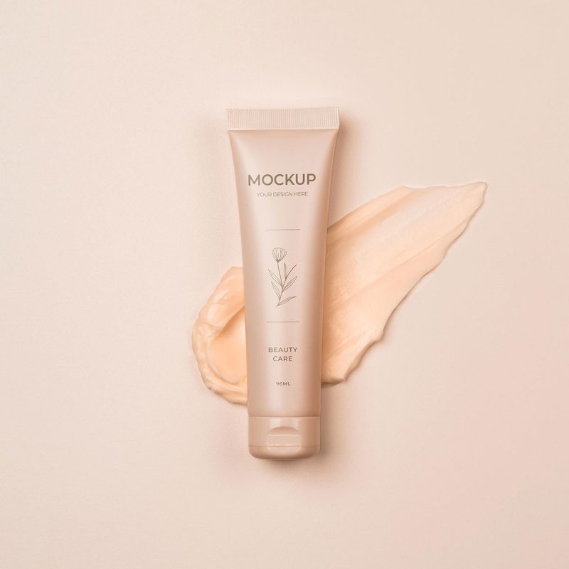 A tube of cream sitting on top of a white surface.